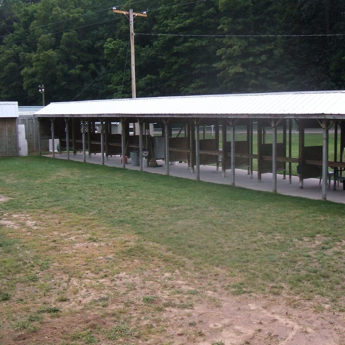 A large building with glass walls on the side of it.