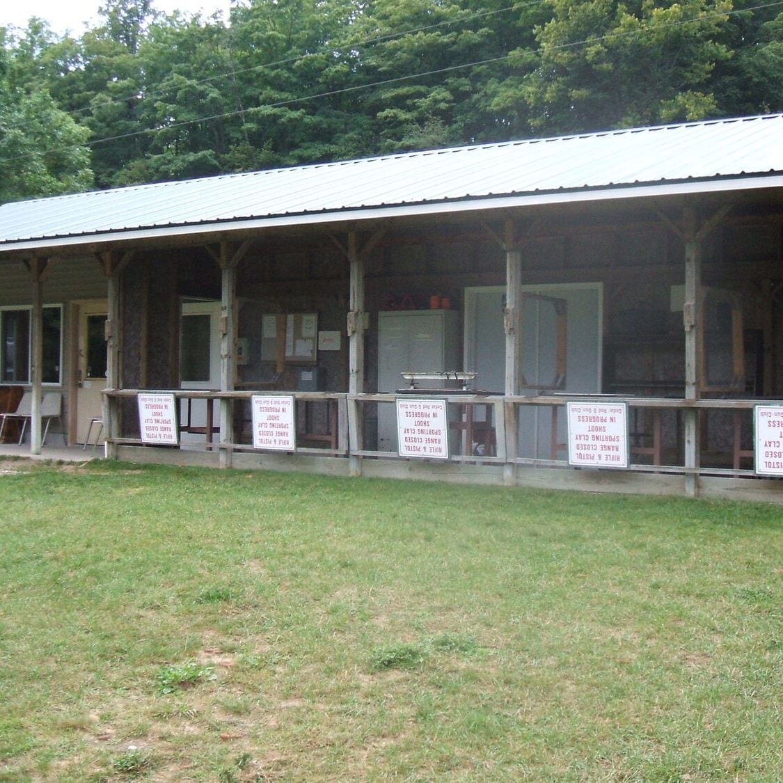 A building with many windows and signs on the side.